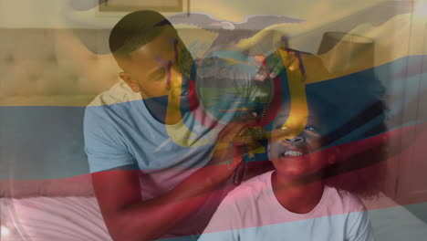 animation of flag of colombia over african american man and his daughter