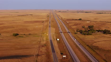 aerial view of a highway through a vast, dry landscape