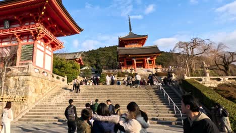 tourists exploring a historic temple staircase