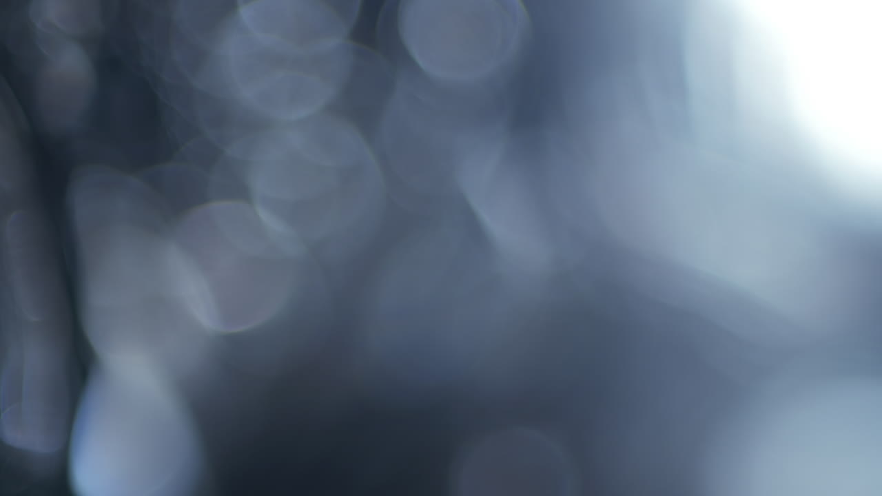 Moving Blue and White Bokeh Light Overlay Effect