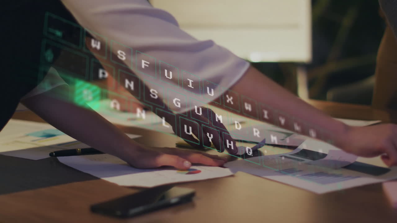 Animation of keyboard over diverse colleagues discussing project