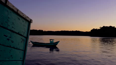 sunset on the river with a small boat