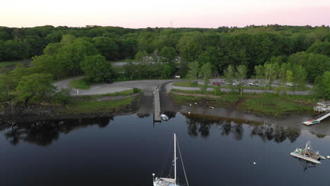 Aerial-High-Flying-Drone-footage-over-fishermen-preparing-to-launch-at-Saco-Bay,-Maine