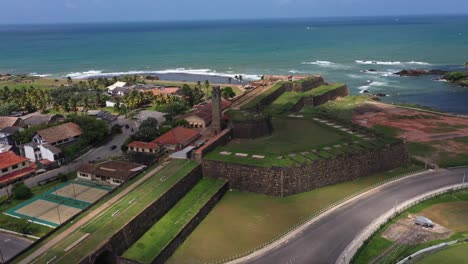 aerial rising over historic galle fort with ocean and landscape in the background in galle in the south coast of sri lanka