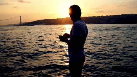 the fisherman preparing the fishing rod