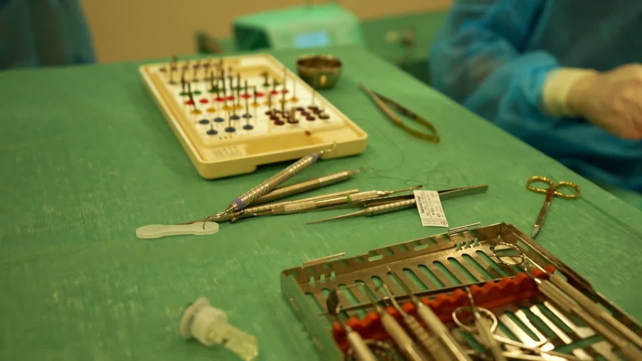 Close-up of Dental Surgical Instruments on a Green Drape
