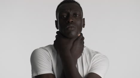 burdened african american man on grey background.