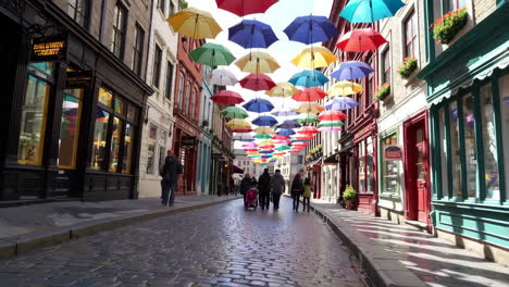 charming european street with colorful umbrellas