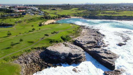 rock ledges at the seashore of the little bay beach in new south wales, australia