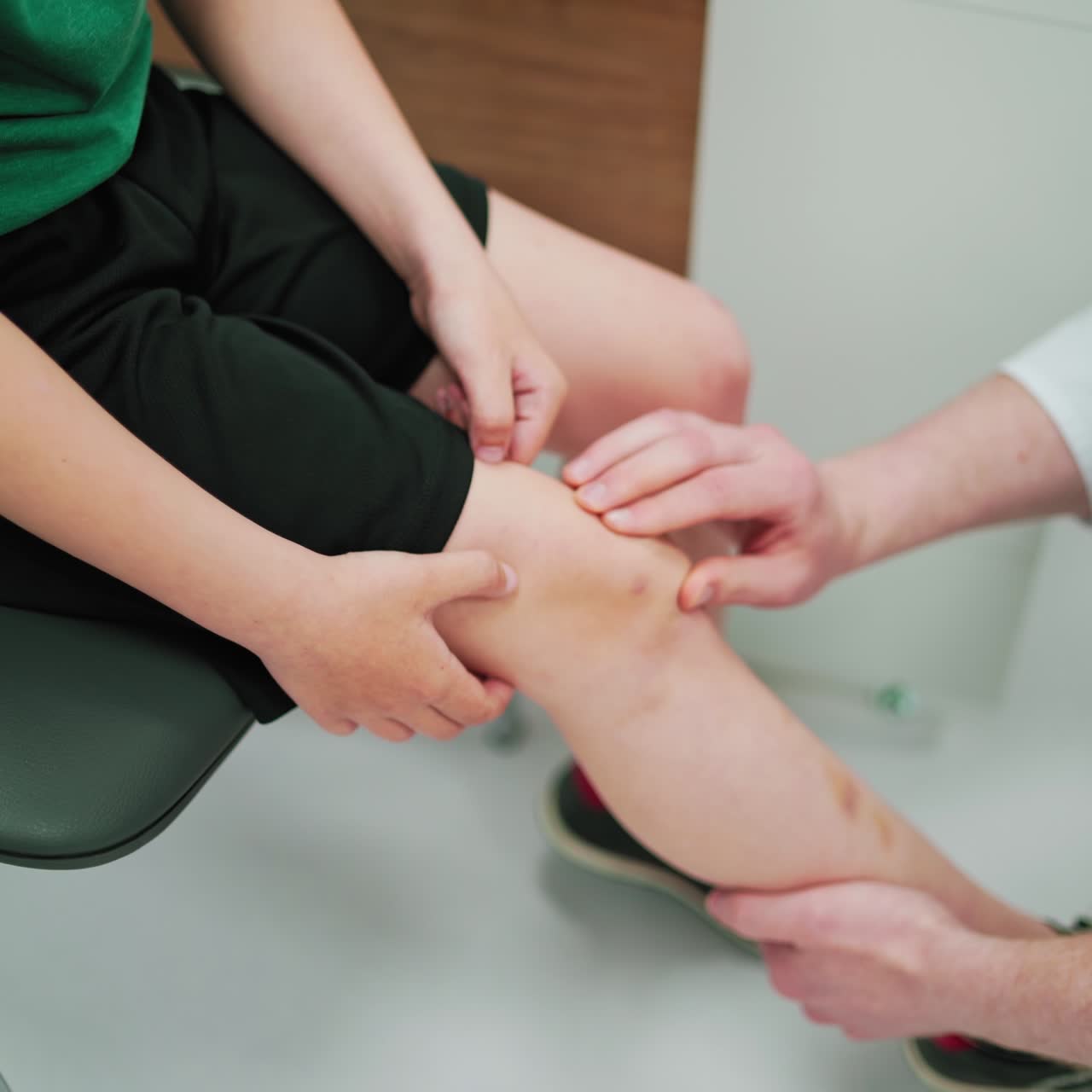 Doctor working with patient in hospital