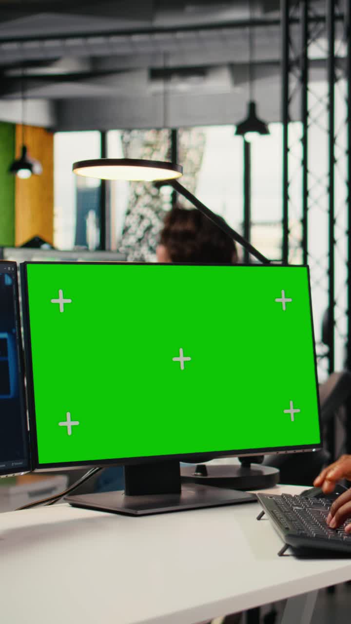 Vertical video Green screen mockup PC used by data scientist in office automating with AI