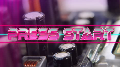 press start text on neon banner against close up of microprocessor connections on motherboard