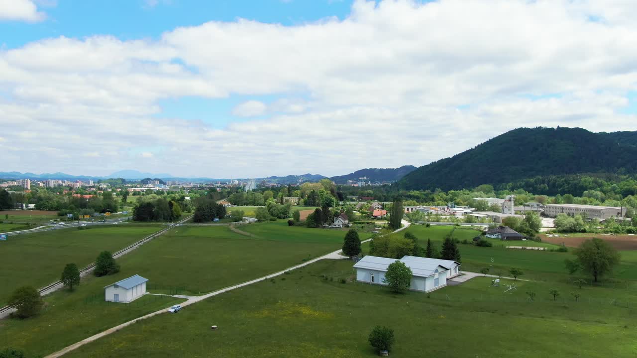 Aerial forward view of extra-urban landscape of Celje city in Slovenia