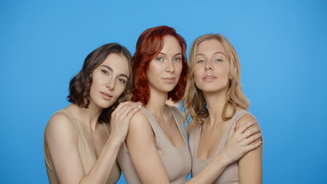 three women posing together