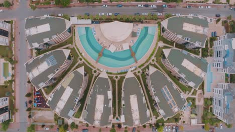 aerial view of modern apartment complex with pool