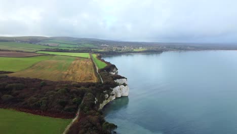 aerial view of farmland and fields on the coast of dorset in england