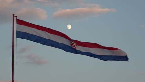 4k. large flag of croatia waving in the wind. it is getting dark