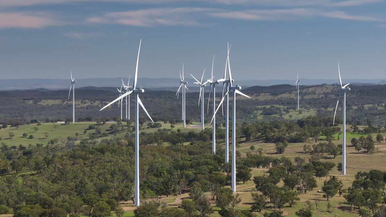 Slow Motion 4K Drone Over Tall Renewable Energy Wind Turbines Spinning Above Rural Countryside In Australia, Slow Motion