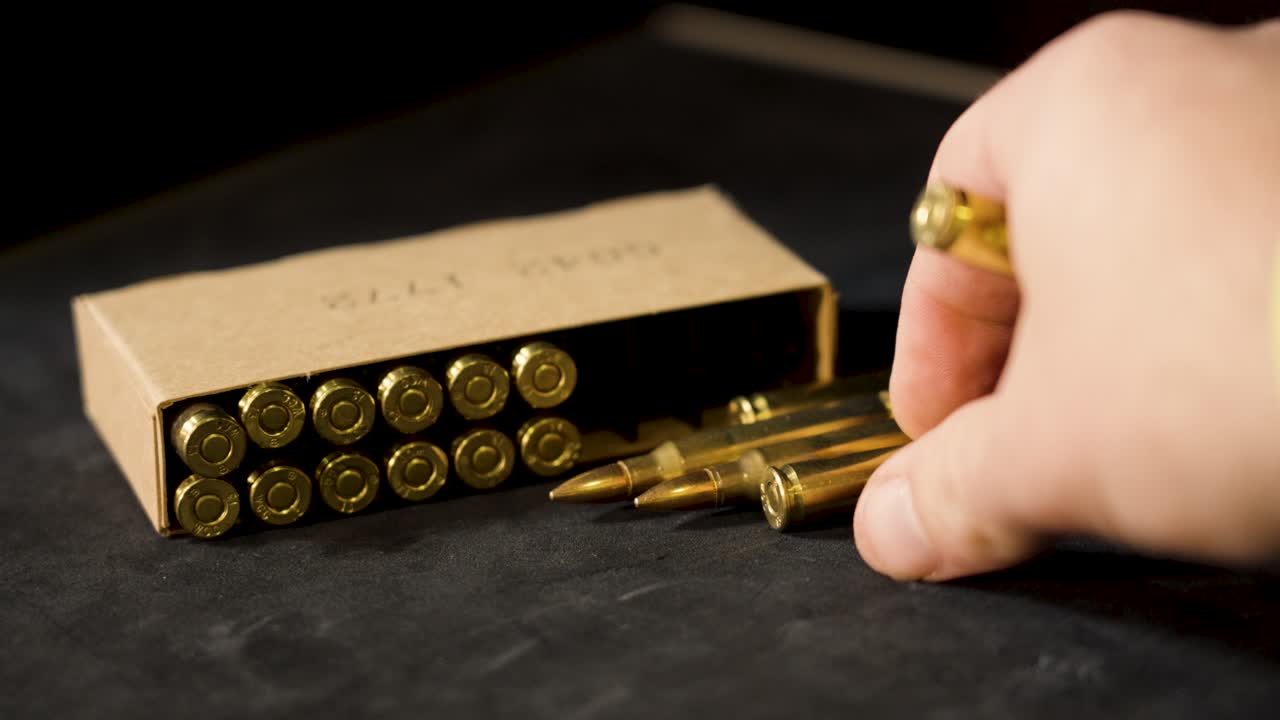 Loose rounds of 5.56 near their box. for civilian use.