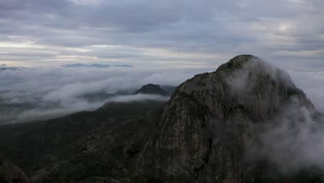 drone footage of sunrise in foggy mountains