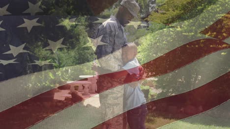 animación de la bandera de los estados unidos ondeando sobre un padre afroamericano abrazando a su hijo