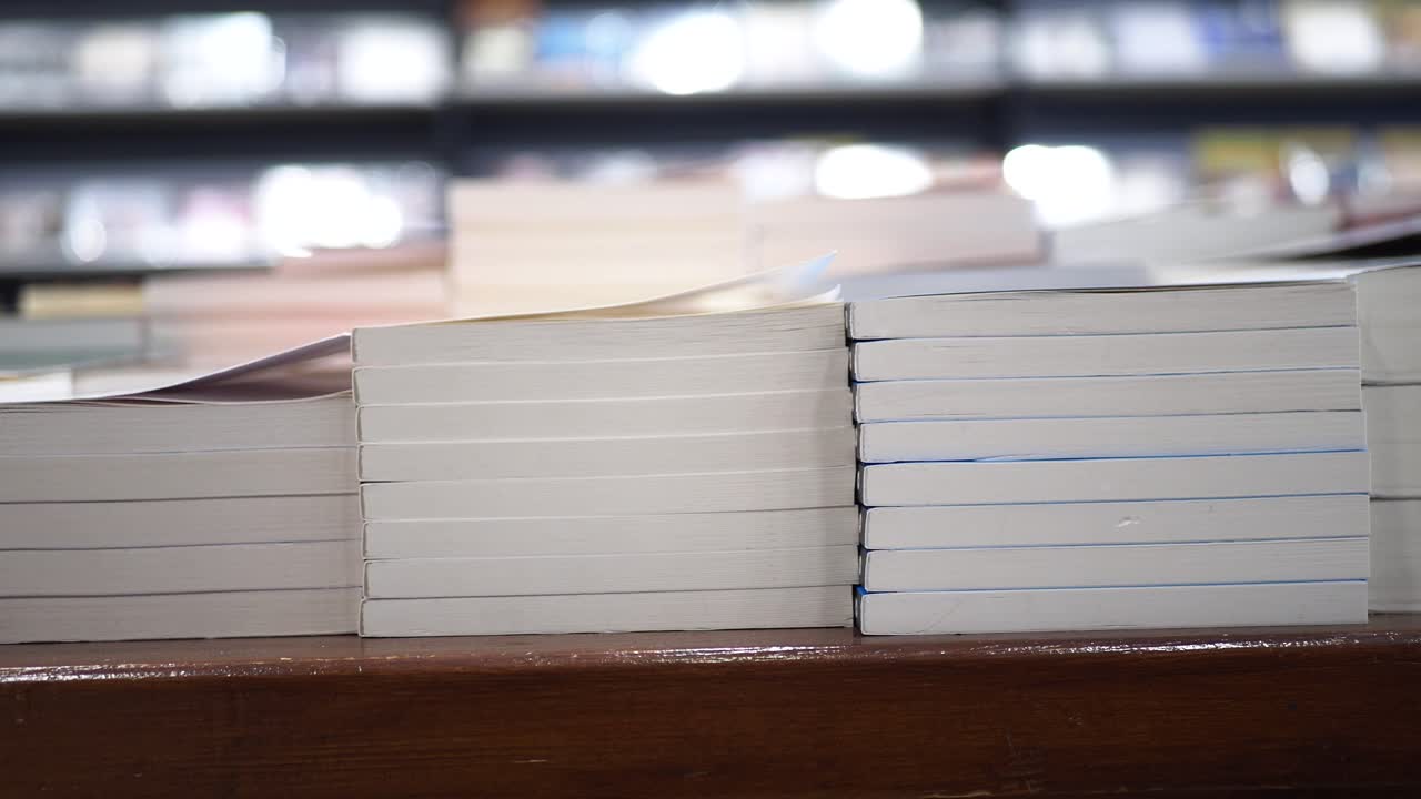 Close up of books stacked on a shelf in a bookstore