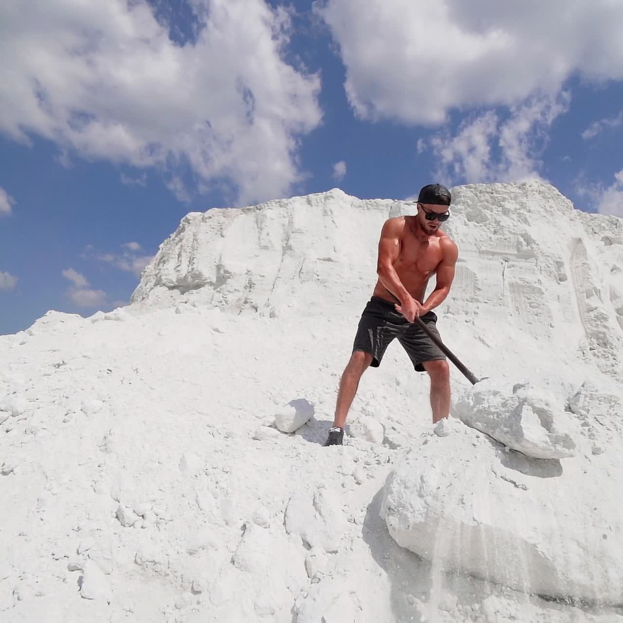 Man doing hammer strike during exercise outside