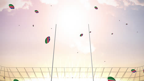 animation of rugby balls coloured with flag of namibia at stadium