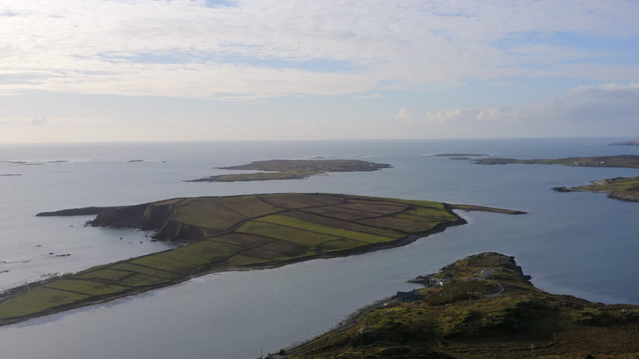 wide aerial dolly shot of Ardmore Island, sky road, Connemara. Ireland