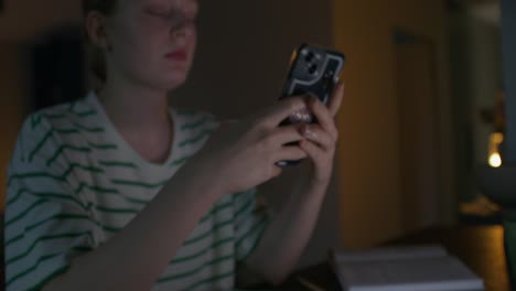 woman using a smartphone at night