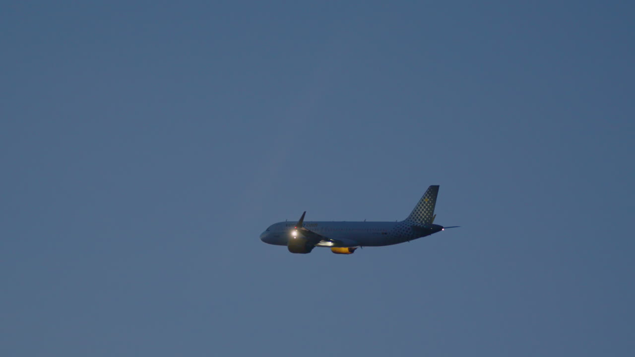 Airplane in flight at dusk