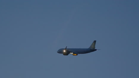 airplane in flight at dusk
