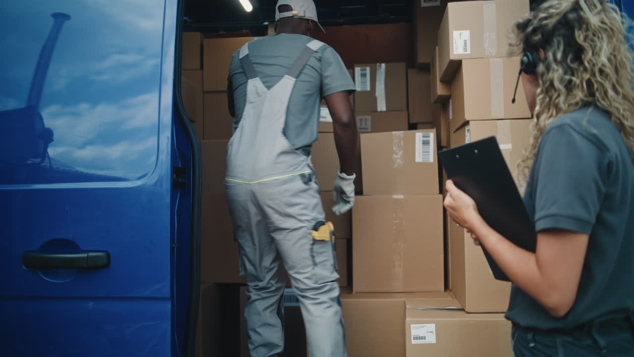 Delivery Team Loading and Unloading Packages from a Van