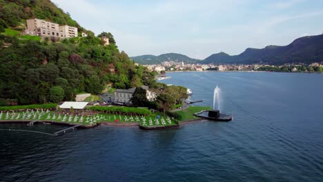 órbita-Aérea,-Villa-Geno-Y-Famosa-Fuente-De-Como,-Lago-De-Como,-Italia