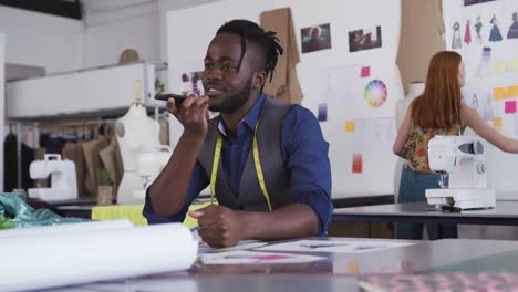 Mixed-race-man-working-in-creative-office