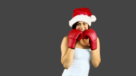 Festive-brunette-boxing-to-camera