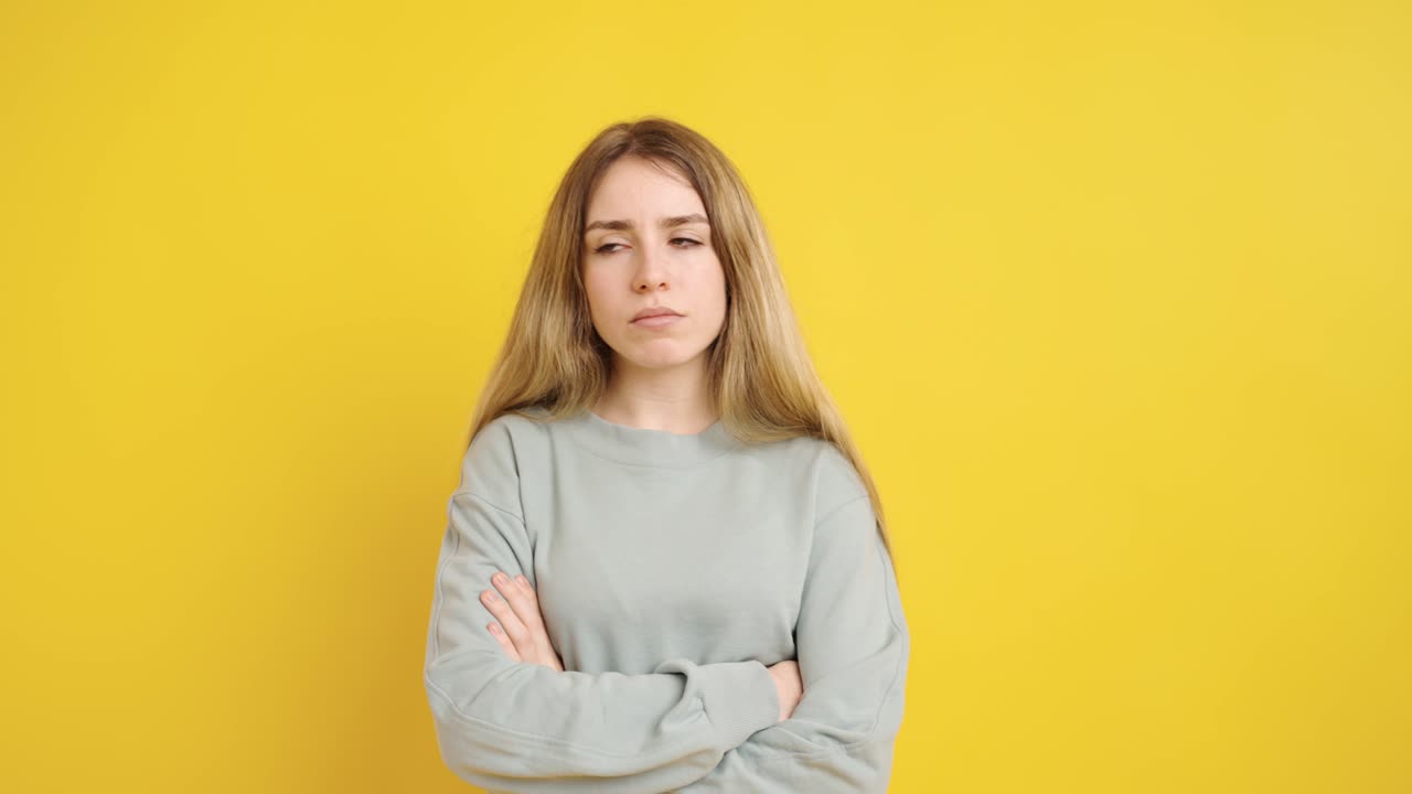 Young woman expressing different emotions on yellow background