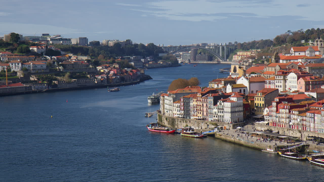 Distant View Of Ponte de Arrabida Crossing Douro River On Sunny Day In Porto, Portugal. wide static shot