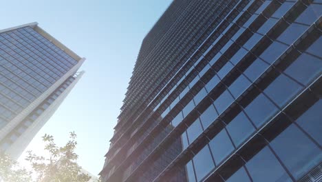 pov to the sky with many skyscraper office building in the big city