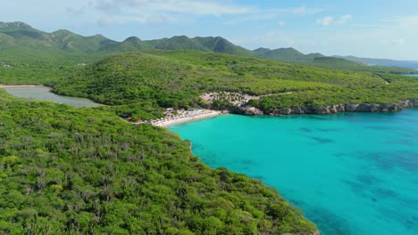 Wide-angle-trucking-panoramic-view-of-Grote-Knip-Curacao-and-surround-mountains-with-salt-pan