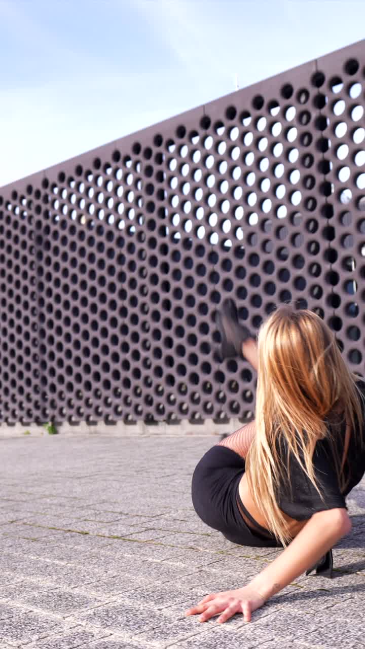 Woman dancing in an urban setting