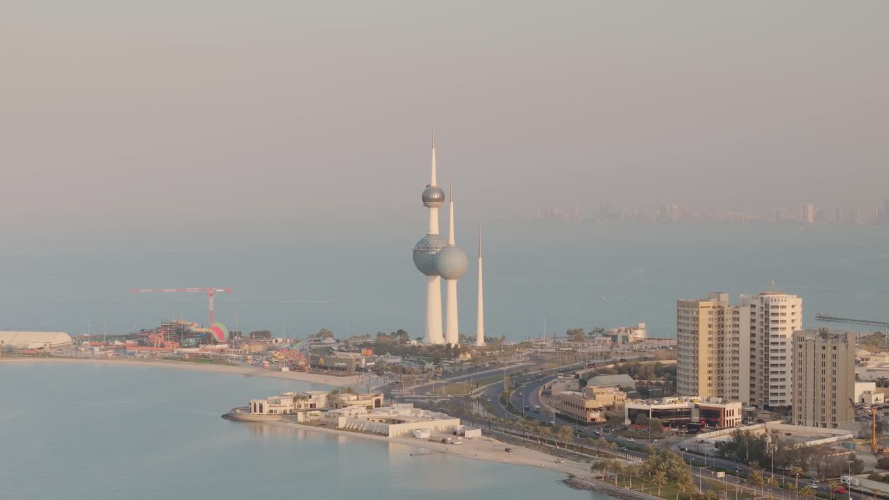 Kuwait Towers which are a group of three slender towers in Kuwait City, standing on a promontory into the Persian Gulf