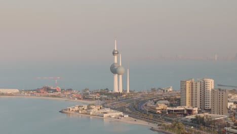 kuwait towers which are a group of three slender towers in kuwait city, standing on a promontory into the persian gulf