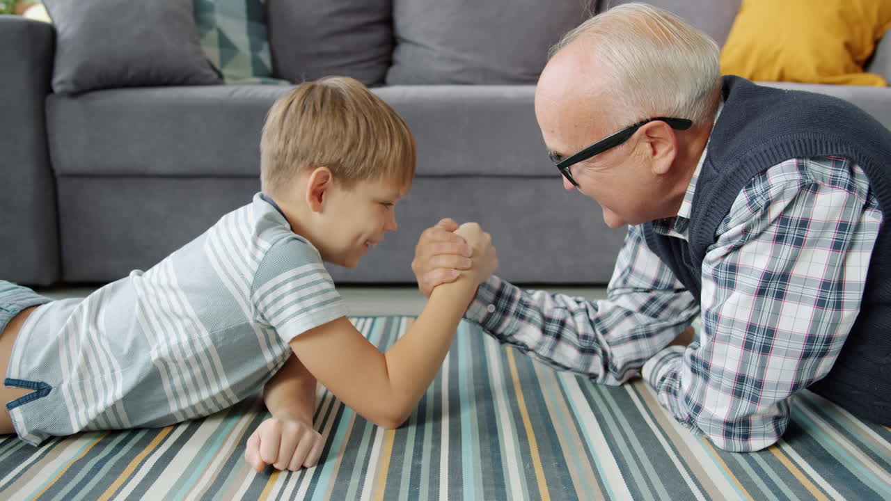 Grandson and Grandfather Arm Wrestling