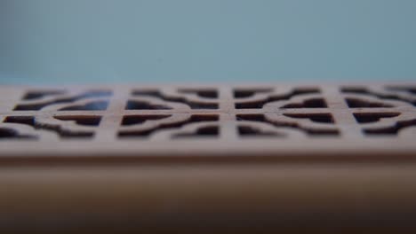 A-close-up-macro-shot-of-smoking-incense-in-a-wooden-box,-spiritual-ritual-meditation,-scented-therapy-fragrance,-relaxing-aromatic-white-smoke,-textured-case,-smooth-cinematic-4K-video-tilt-up