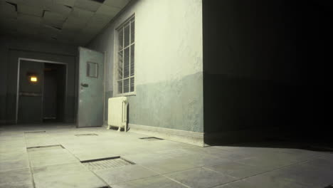 abandoned hallway in a dimly lit building with an open door and radiator