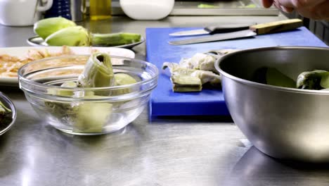 Removing-artichoke's-leaves-for-a-delicious-and-hand-made-Mediterranean-dish