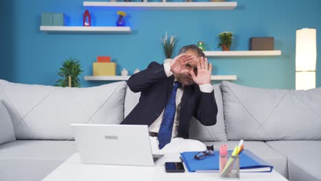 home office worker man looking at camera with fear and doubt.