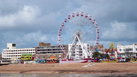 ferris wheel spinning at a beach carnival