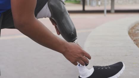 Side-view-man-with-prosthetic-leg-stretching